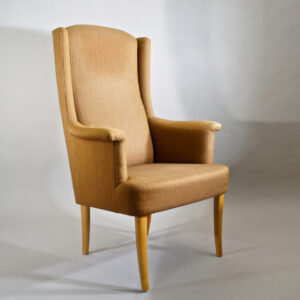 Easy chair by Carl Malmsten ¨Ane¨. Upholstered chair with legs in wood. Fåtölj Wigerdals värld