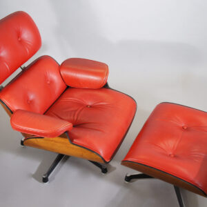 Easy chair with ottoman in teak, seat in leather and base in steel. Swivel funktion. Maker unknown.