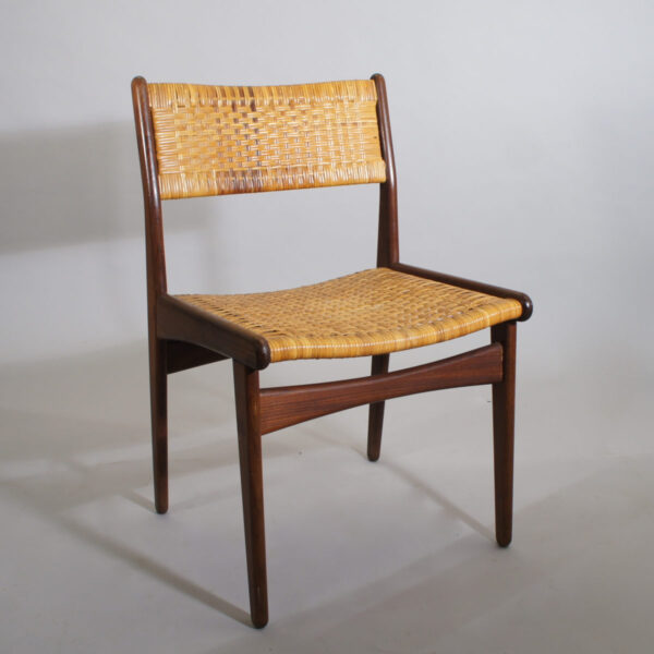 Four teak chairs in teak with seats and back in rattan. Made in Denmark. Partly renovated.
