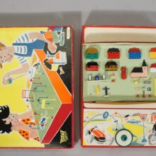 Driving school toy containing a magnetic driven car or motorbike with houses, road signs etc. Perma, Wester Germany 1950. Rare and good condition, parts missing.