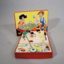 Driving school toy containing a magnetic driven car or motorbike with houses, road signs etc. Perma, Wester Germany 1950. Rare and good condition, parts missing.