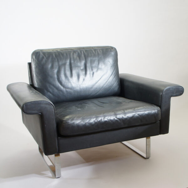 Easy chair in black leather and steel legs by Asko, Finland. W 100 D 76 H 74 SH 40 cm.