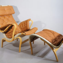 Bruno Mathsson for Dux "Pernilla 69". Easy chair with ottoman and with new leather cover.