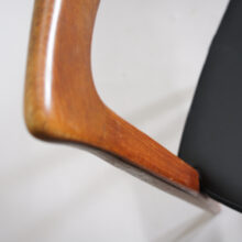 Four side chairs in teak with seat cover in leather imitation.