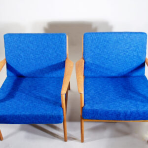 Folke Ohlsson for Dux, Sweden. "USA 75". Easy chairs in teak with new seatings with vintage wool fabric and new rubber bottom.er