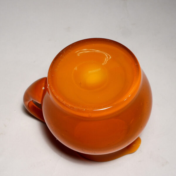 Erik Höglund for Kosta. Signed jug in orange glass.