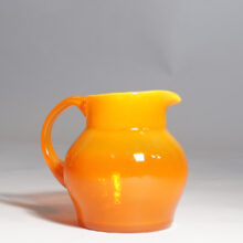 Erik Höglund for Kosta. Signed jug in orange glass.