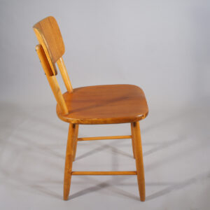 Four dining chairs in beech and teak.