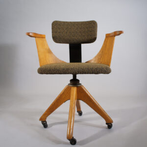 Desk chair in oak and new upholstered seat and back. 1920's. Maker unknown.