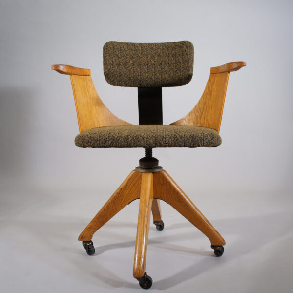 Desk chair in oak and new upholstered seat and back. 1920's. Maker unknown.