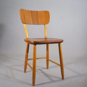 Four dining chairs in beech and teak.