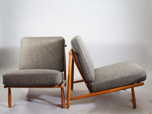 Alf Svensson for Dux, Sweden. "Domus". A pair of easy chairs i teak with new upholstered seatings.