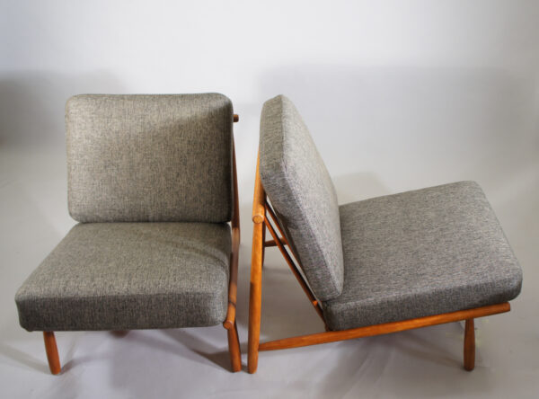 Alf Svensson for Dux, Sweden. "Domus". A pair of easy chairs i teak with new upholstered seatings.
