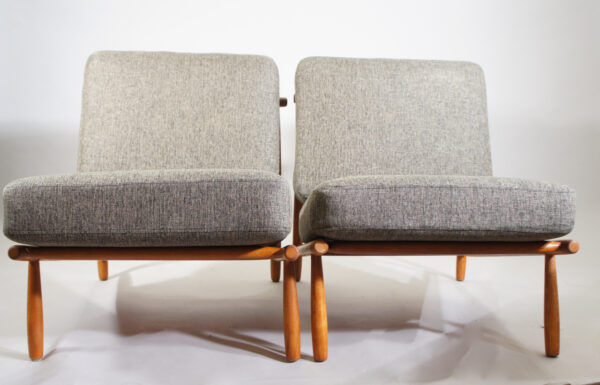 Alf Svensson for Dux, Sweden. "Domus". A pair of easy chairs i teak with new upholstered seatings.