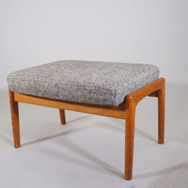 Folke Ohlsson for Dux, Sweden.Ottoman in teak with new upholstered seat in wool fabric.