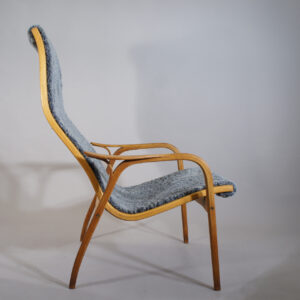 Yngve Ekström for Swedese, Sweden ."Lamino". Easy chair in oak with new sheep skin.