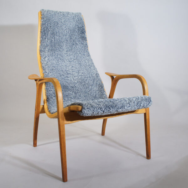 Yngve Ekström for Swedese, Sweden ."Lamino". Easy chair in oak with new sheep skin. Fåtölj nyklädd. Wigerdals Värld