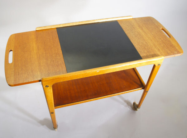 Yngve Ekström "Thea". Serving trolley in teak and laminate on wheels. Serveringsvagn, tévagn