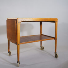 Yngve Ekström "Thea". Serving trolley in teak and laminate on wheels. Serveringsvagn tévagn.