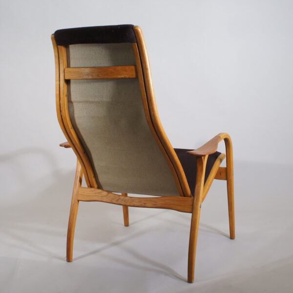 Yngve Ekström for Swedese, Sweden. Lamino. Easy chair new upholstered with wood in oak and teak.