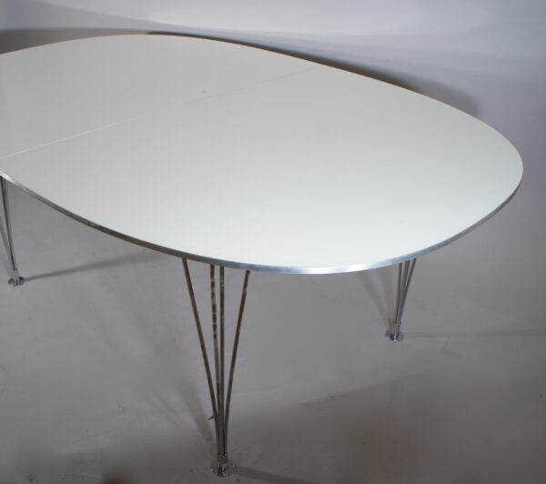 Piet Hein & Bruno Mathsson for Fritz Hansen. "Superellips". Dining table with laminate top, edge in aluminium and legs in crome steel. One extension board.