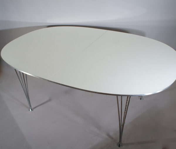 Piet Hein & Bruno Mathsson for Fritz Hansen. "Superellips". Dining table with laminate top, edge in aluminium and legs in crome steel. One extension board.Matbord med iläggsskiva. Wigerdals Värld