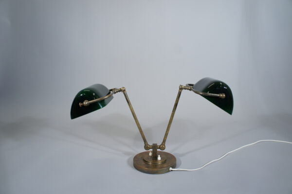 Desk lamp in brass with two arms and shades in glass. 1930's. Tvåarmad Skrivbordslampa i mässing med glasskärmar 1920-tal