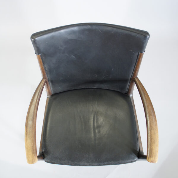 Arm chair in mahogany and leather. Karmstol i mahogny och svart skinn wigerdals.