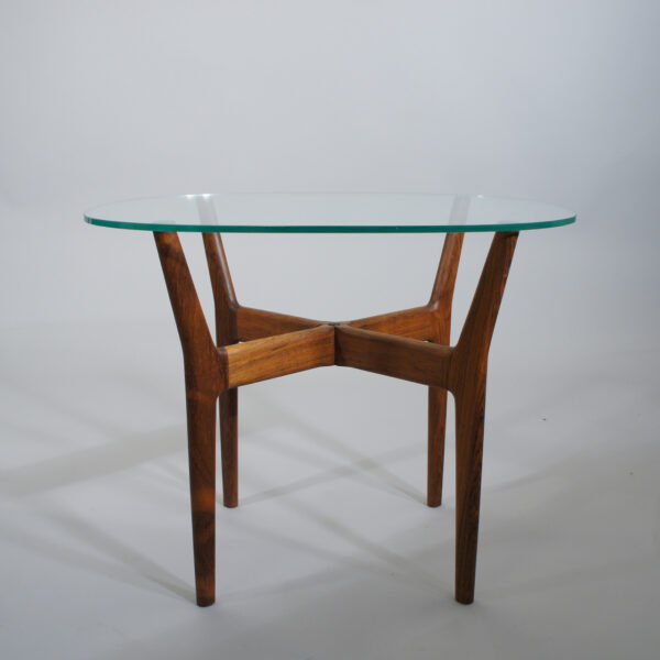Side table by Illum Wikkelsö in rosewood and glass top. Lampbord