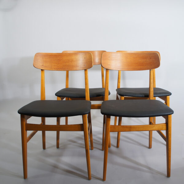 Side chairs in teak beech with seats in sky.