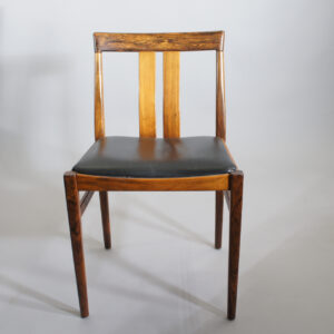 Four side chairs in rosewood/palisander with seats in leather