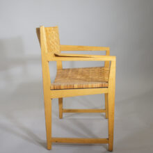 A pair of arm chairs in oak and rattan. Wigerdals Värld Ett par karmstolar i ek och rotting