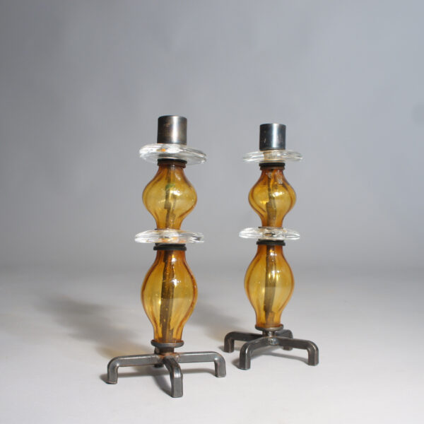 Erik Höglund for Kosta, Sweden. A pair of candle sticks in iron and glass. 1960's. Ljusstakar i glas och smide Wigerdals Värld