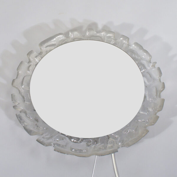 Wall mirror in glass and plastic with lightning. Väggspegel i plast och glas med belysning Wigerdals