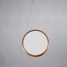 Östen & Uno Kristainsson for Luxus Sweden. Wall mirror in rosewood with leather strap. Väggspegel i jakaranda Wigerdals