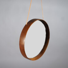 Östen & Uno Kristainsson for Luxus Sweden. Wall mirror in rosewood with leather strap. Wigerdals Värld Väggspegel i jakaranda