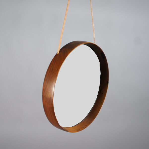 Östen & Uno Kristainsson for Luxus Sweden. Wall mirror in rosewood with leather strap. Wigerdals Värld Väggspegel i jakaranda