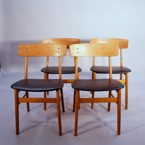 4 of 1950's dining chairs in teak and seats in sky.