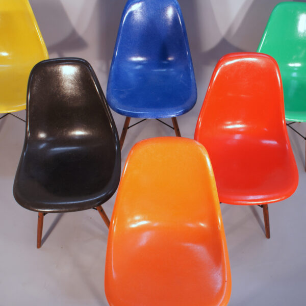 Charles and Ray Eames for Herman Miller USA. DSW. Six 6 side chairs in glass fiber in different colors with wood legs Wigerdals