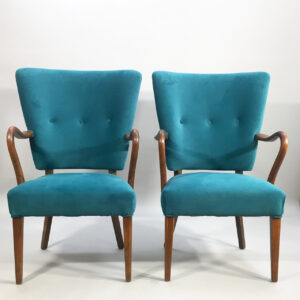 1950's easy chair in teak and velvet cover. Ett par fåtölj i er sammet och teak.