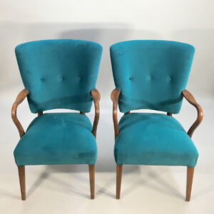 1950's easy chair in teak and velvet cover. Ett par fåtöljer i sammet och teak.