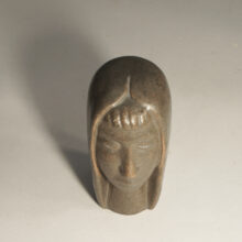 Sculpture in stonware of womans face by Åke Holm, Sweden.