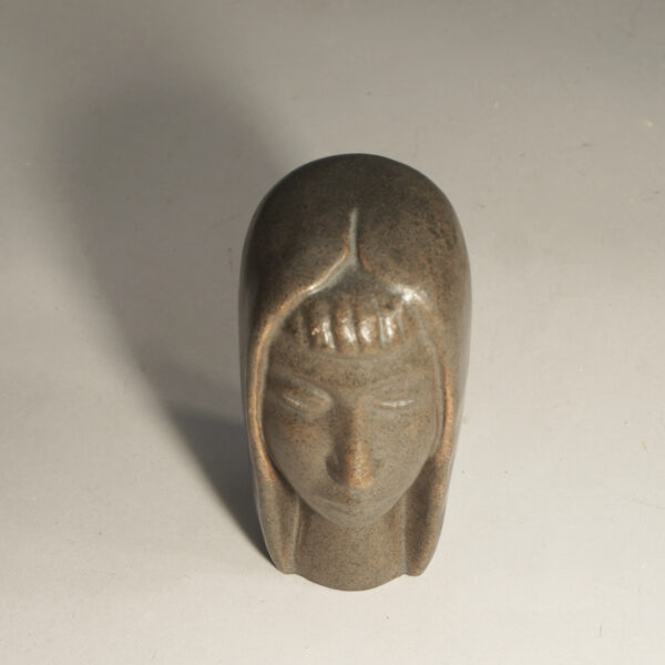 Sculpture in stonware of womans face by Åke Holm, Sweden.