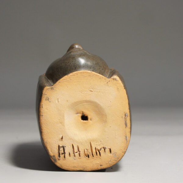 Sculpture in stonware of womans face by Åke Holm, Sweden.