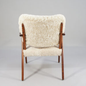 A pair of 1950's armchairs in birch and sheep skin. Fåtöljer björk fårskinn karmstol 50-tal. Wigerdal.com