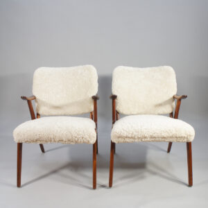 A pair of 1950's armchairs in birch and sheep skin. Ett par fåtöljer i björk och fårskinn Wigerdal.com
