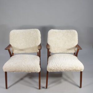 A pair of 1950's armchairs in birch and sheep skin. Ett par fåtöljer i björk och fårskinn wigerdal.com