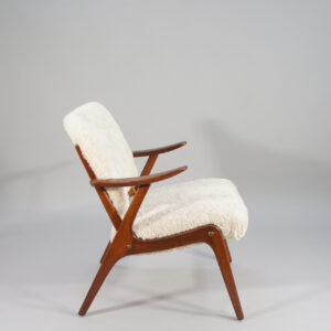 A pair of 1950's armchairs in beech and sheep skin. Ett par fåtöljer i björk och fårskinn. wigerdal.com