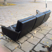 Poul Kjaerholm for E Kold Christansen,Denmark. Pk31-3 3 sit sofa in black leather and legs in steel.. Wigerdal.com