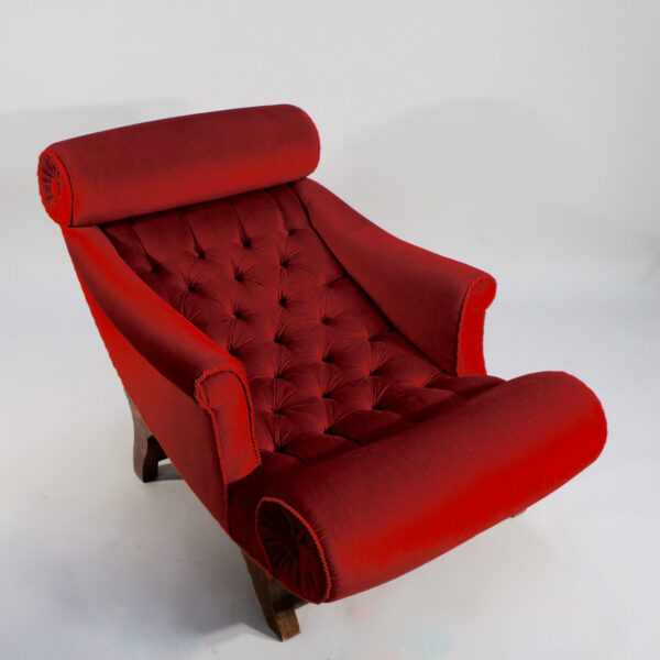 Adolf Loos. "Knieschwimmer" 1906. Easy chair in new production with velvet and legs in wood.